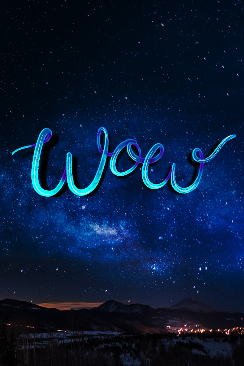 Typography - 'Wow' in the starry night sky over a snowy / landscape